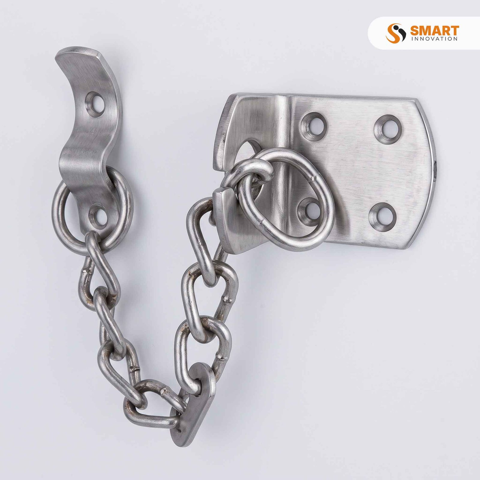 A Door Chain fitted to an entrance door, allowing it to be opened partially while staying securely restrained.