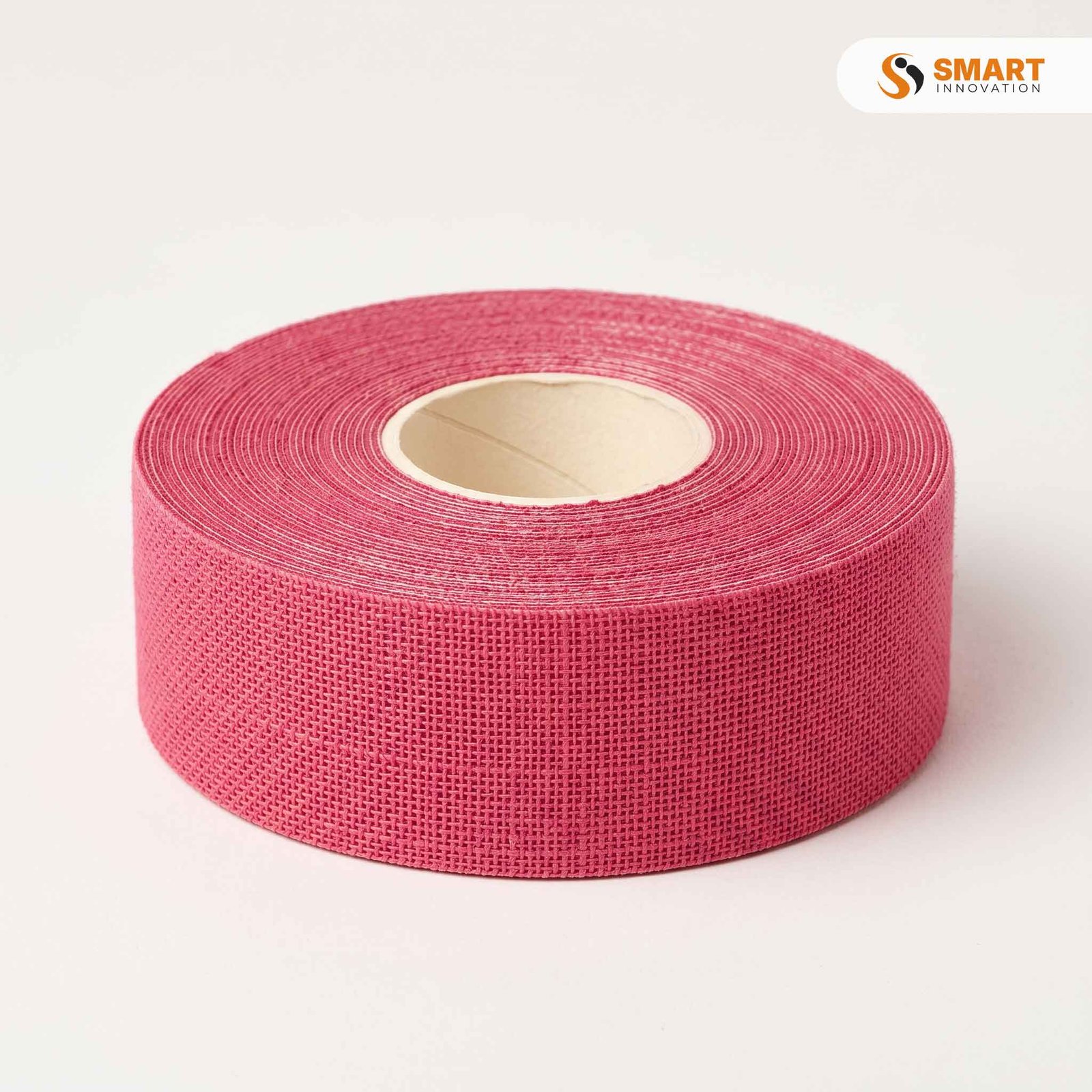 pink self adhesive scrim tape applied over a plasterboard joint
