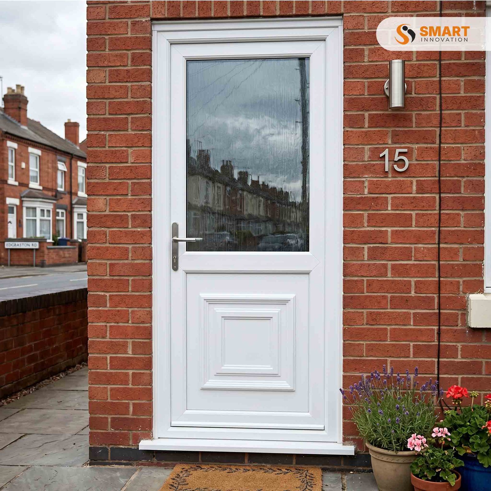White UPVC decorative panel back door with obscure double-glazed upper panel installed in a brick house