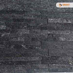 Black Split Face tiles installed as a premium feature wall backdrop around a contemporary media unit