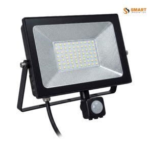 LED floodlight with motion sensor, mounted outdoors, lighting up automatically when triggered.