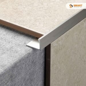 Square Edge L Shape PVC Tile Trim White installed as a sharp border on a contemporary bathroom tiled corner