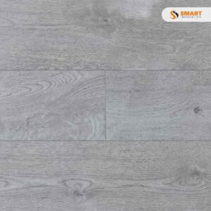Laminate Oak Stone 8mm floorboards installed seamlessly across a modern, open-plan minimalist apartment living zone