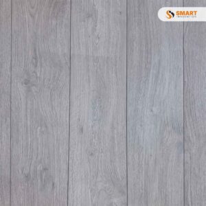 Laminate Rockford Oak 8mm flooring installed across a bright, contemporary open-plan living room floor layout