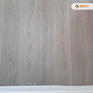 Laminate Tomahawk Oak 12mm premium floorboards installed across a spacious, rustic-modern living room area