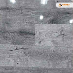 Laminate Up Town 8mm modern floorboards installed seamlessly across a chic, urban loft living room floor