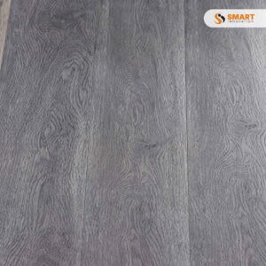 Spc Flooring Dark Grey interlocking planks laid out in a spacious, contemporary industrial loft apartment floor