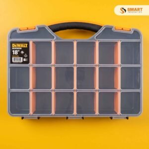 Tool Storage Screw Box with adjustable compartment dividers holding various metal screws and wall plugs on a workshop bench